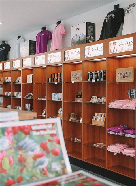 Shelves of Slim Dusty merchandise for sale in the Slim Dusty Centre.